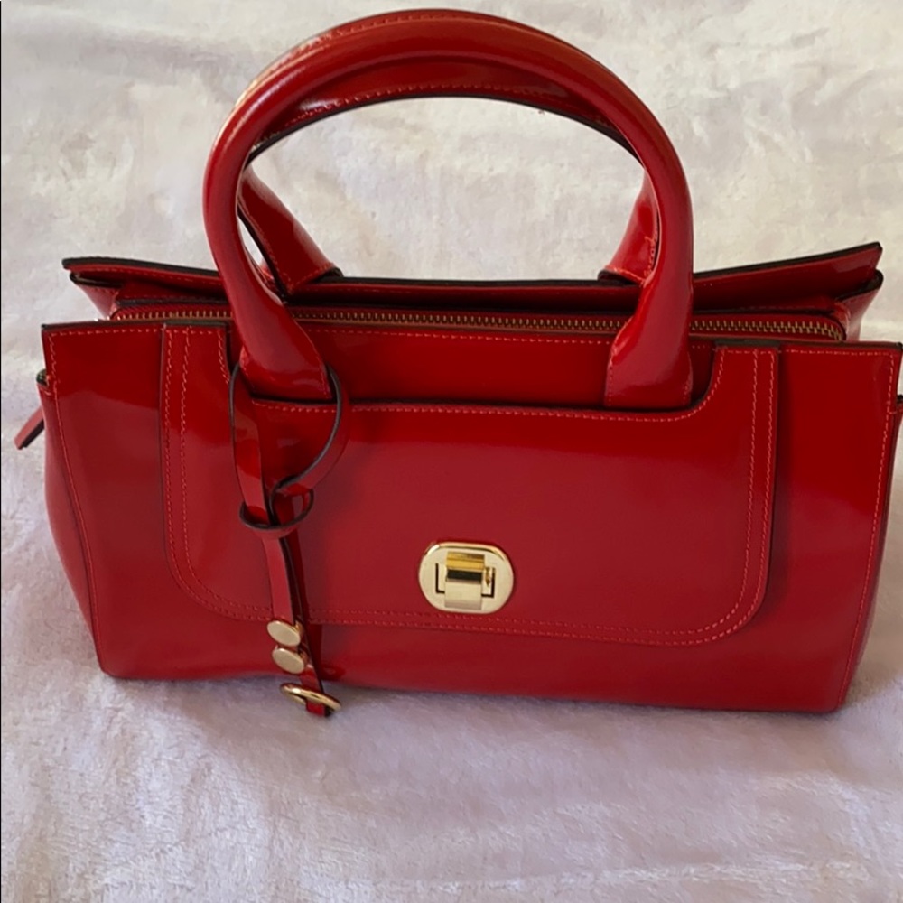 Asia Bellucci red bag